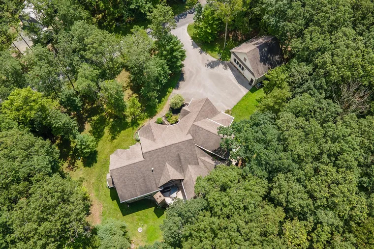 Aerial view of Woodland Chalet surrounded by forest at Deep Creek Lake